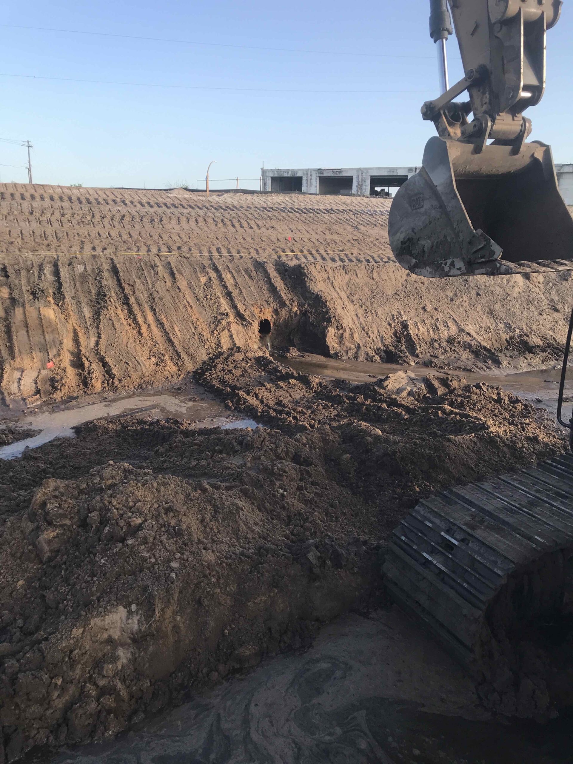 A picture of construction equipment digging up dirt.